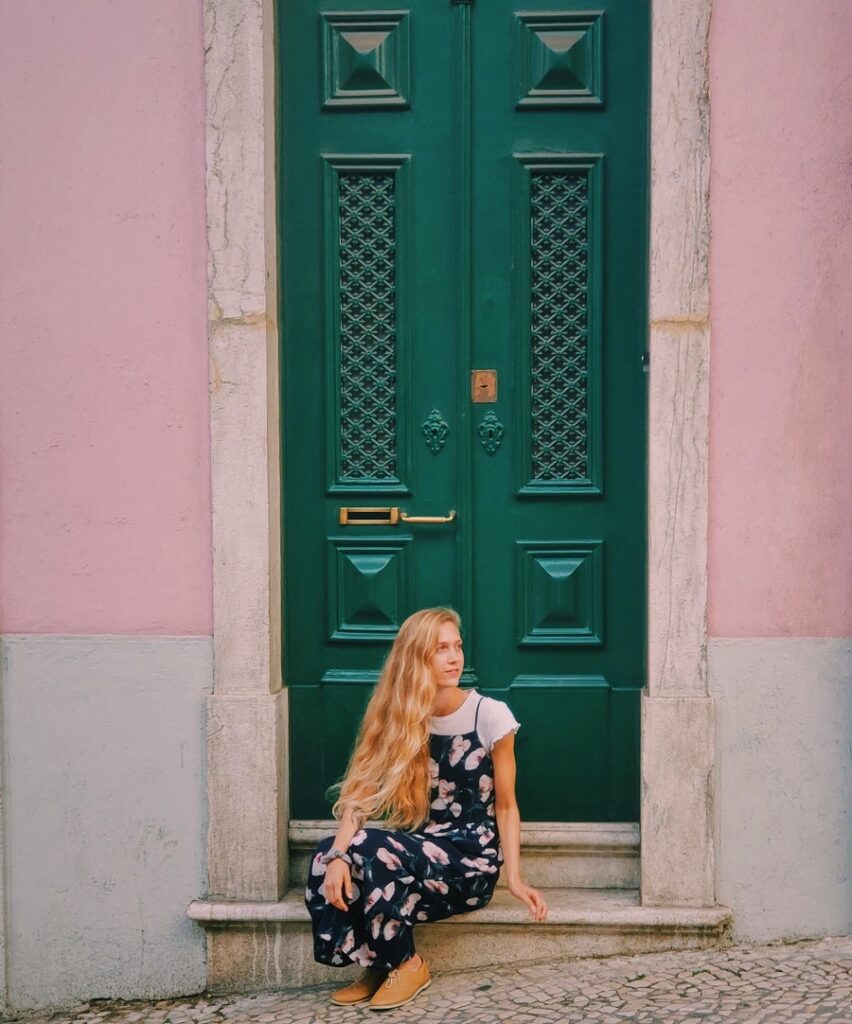 Woman in front of green door